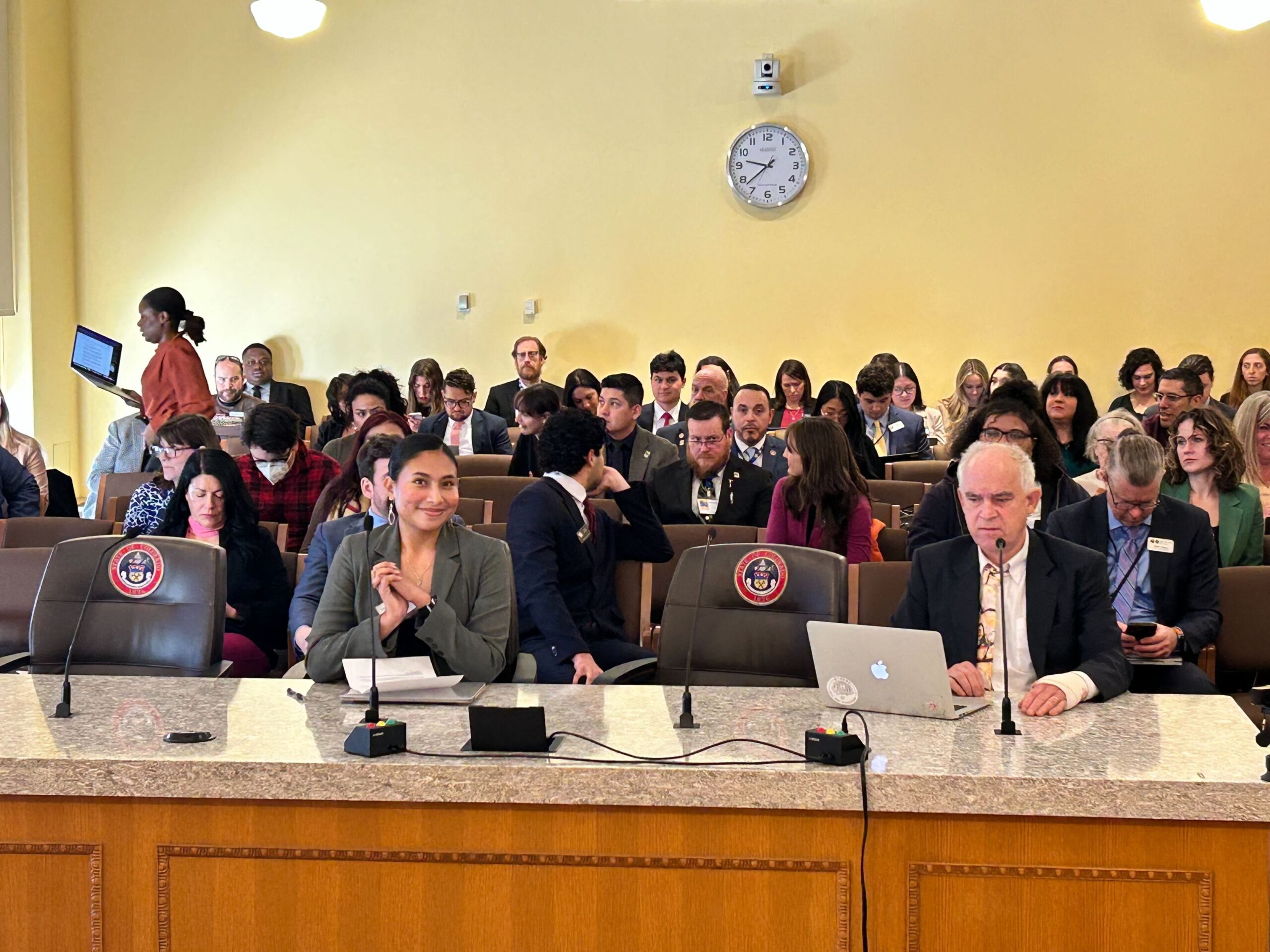 Regional Lead Organizer Kimberley Carracedo testifies on behalf of New Era Colorado during a committee hearing.