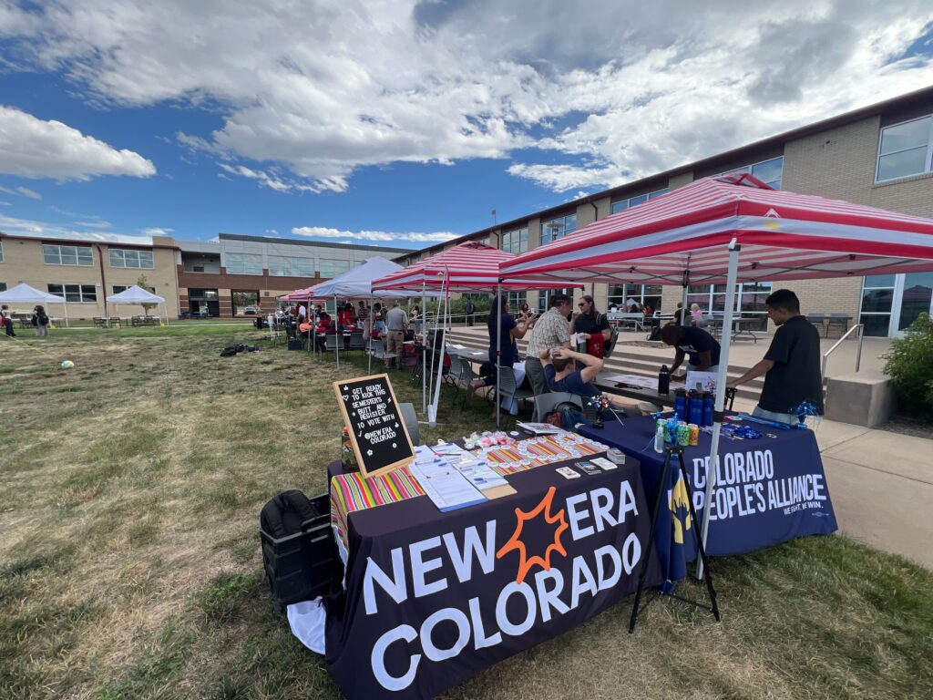 The New Era Colorado team tabling at the Community College of Aurora