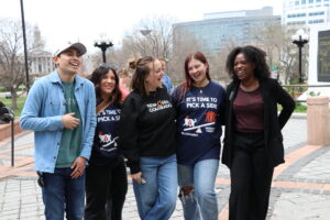 Photo of New Era team members at the 2025 Tax Day rally.
